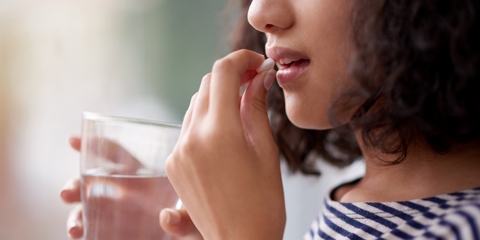 woman taking medication
