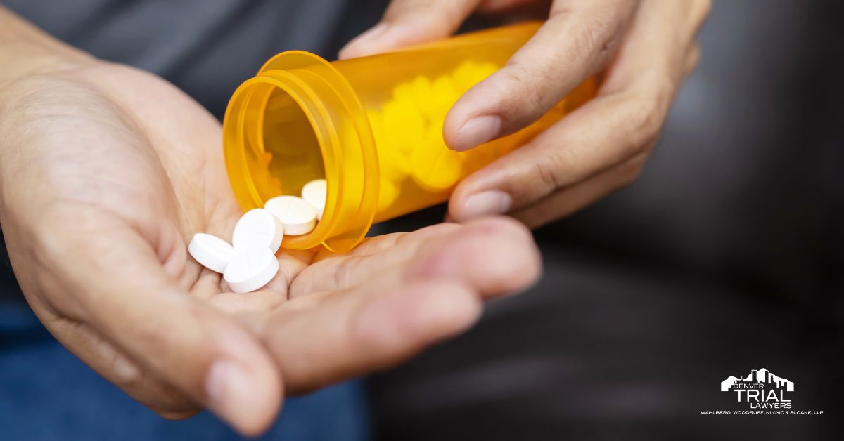 Spilling pills from a bottle into hands.