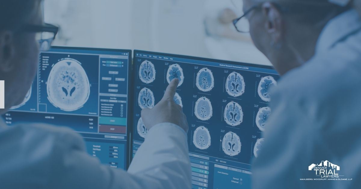 Two doctors looking at digital images of a brain.